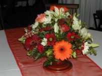 Table flower arrangement in pedestal pottery vase